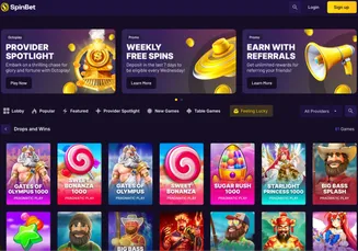 SpinBet homepage with active promos like Provider Spotlight, Weekly Free Spins, Referral Rewards, and featured slots from Pragmatic Play